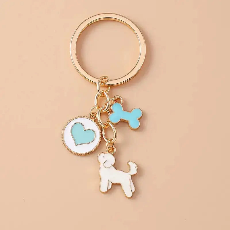 Cute enamel cartoon dog and penguin keychain by Hypes Inventory, featuring heart and star charms for bags and keys.