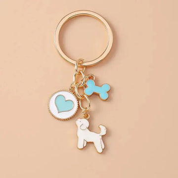 Cute enamel cartoon dog and penguin keychain by Hypes Inventory, featuring heart and star charms for bags and keys.
