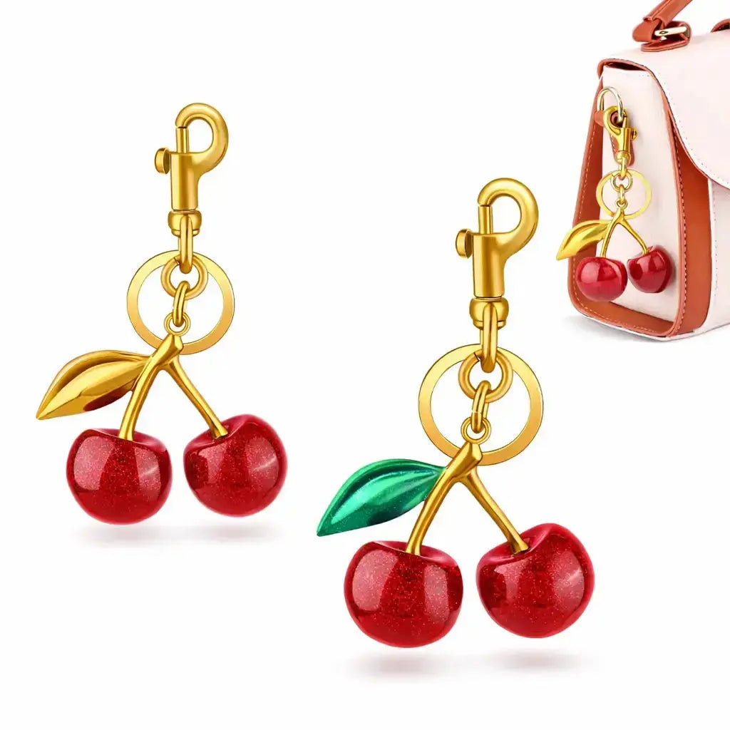 Red cherry purse charm keychain by Hypes Inventory, featuring a cute cherry and strawberry design for handbags and gifts for women.