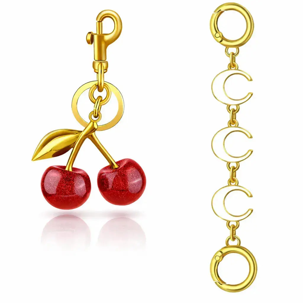 Red cherry purse charm and strawberry keychain by Hypes Inventory, perfect for handbags and adding a cute touch.