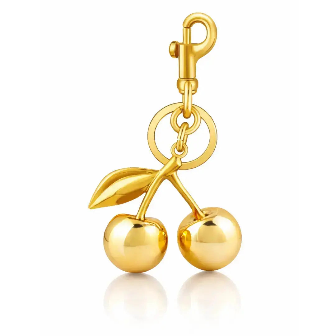 Red cherry purse charm keychain by Hypes Inventory, featuring a cute cherry and strawberry design for handbags and gifts.