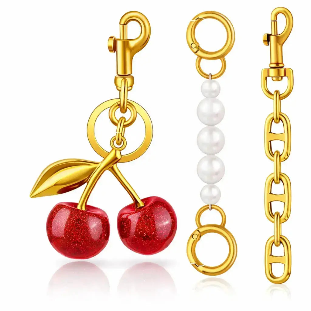 Red cherry purse charm keychain by Hypes Inventory, featuring a cute strawberry design, ideal for handbags and women’s accessories.