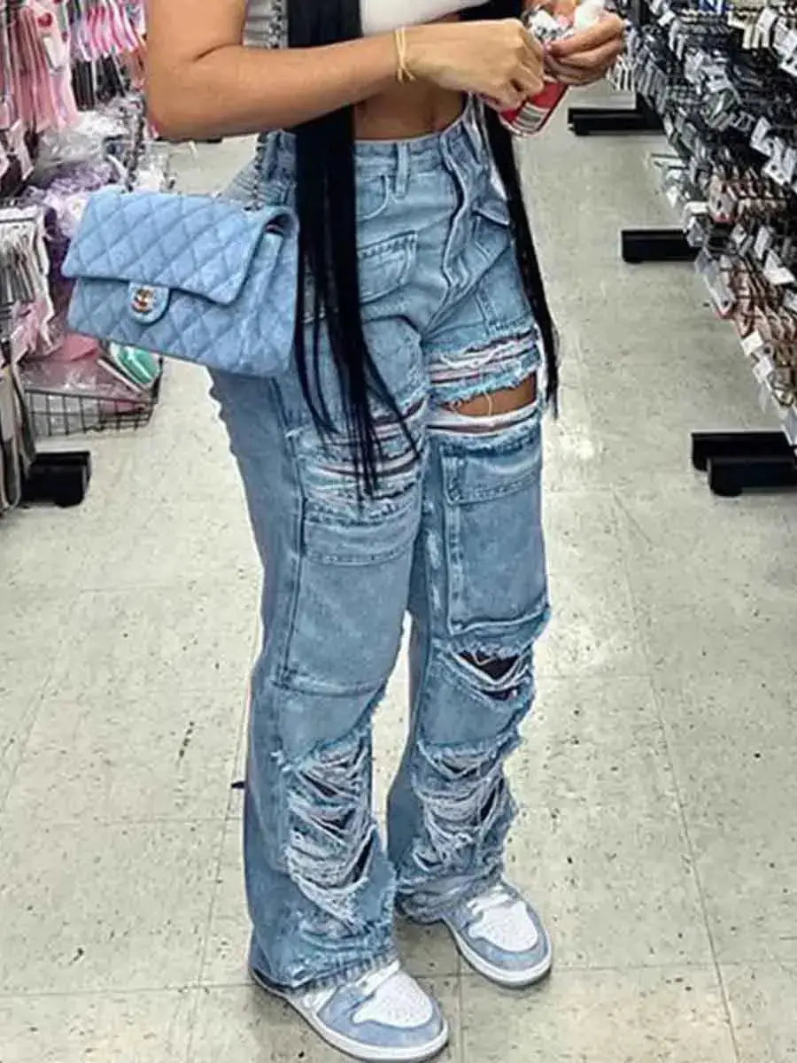 Blue Flairé™ high waist ripped jeans for women with distressed details and raw hem, showcasing stylish denim pants.