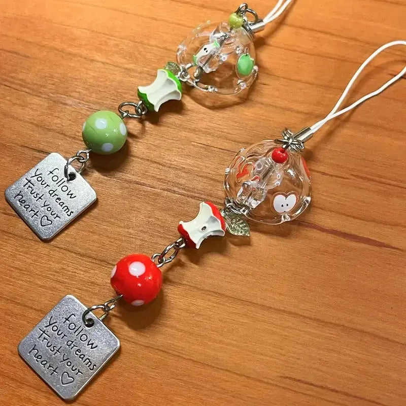 Cute fruit keychain charm featuring an apple and watermelon, perfect Y2K bag accessory for women by Hypes Inventory.