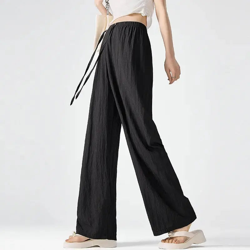Dark gray Flairé™ high waist wide leg pants for women, relaxed fit minimalist trousers with a stylish, comfortable design.