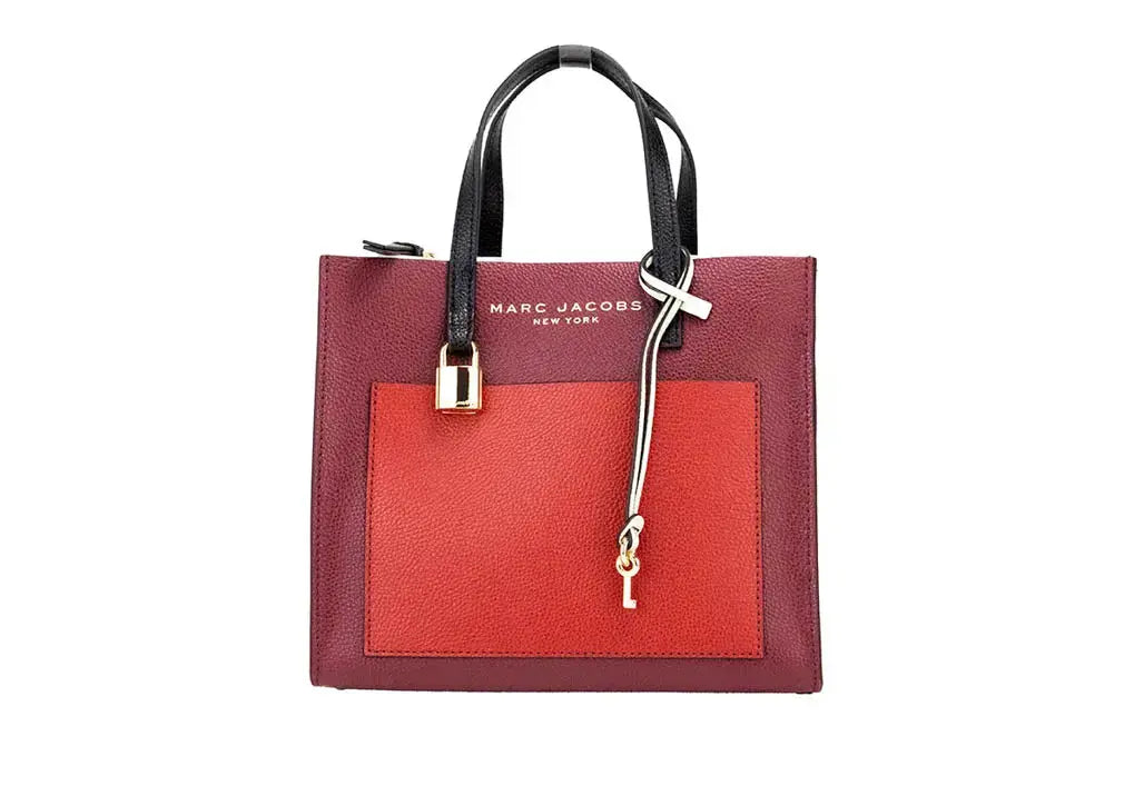 Marc Jacobs Grind Mini leather tote bag in pomegranate color block, stylish crossbody bag with structured design.