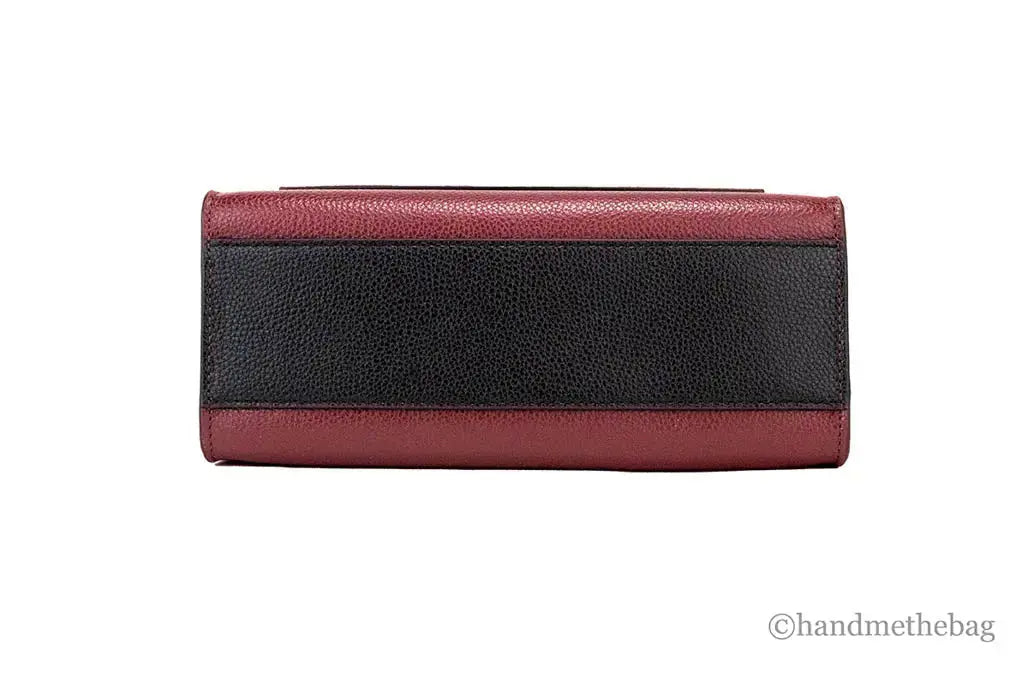 Marc Jacobs Grind Mini leather tote in pomegranate color block, stylish crossbody bag with structured design and durable leather material.