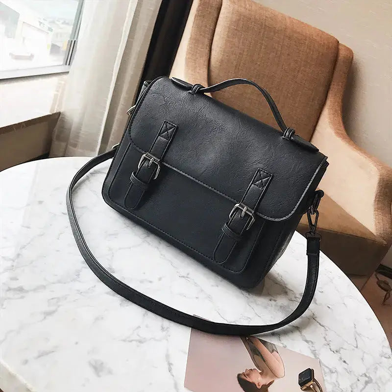 Hypes Inventory women's tassel crossbody bag with square shoulder design, featuring tassel accents and a compact, stylish silhouette.