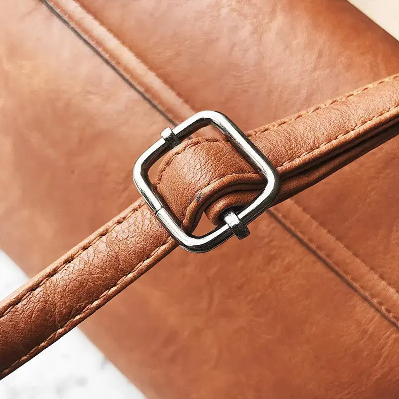 Hypes Inventory tassel crossbody bag for women, square shoulder handbag with tassel detail and adjustable strap.