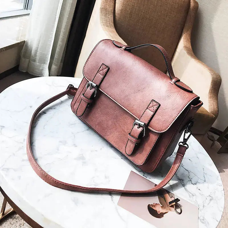 Hypes Inventory tassel crossbody bag for women with square shoulder design, featuring a stylish and functional handbag.