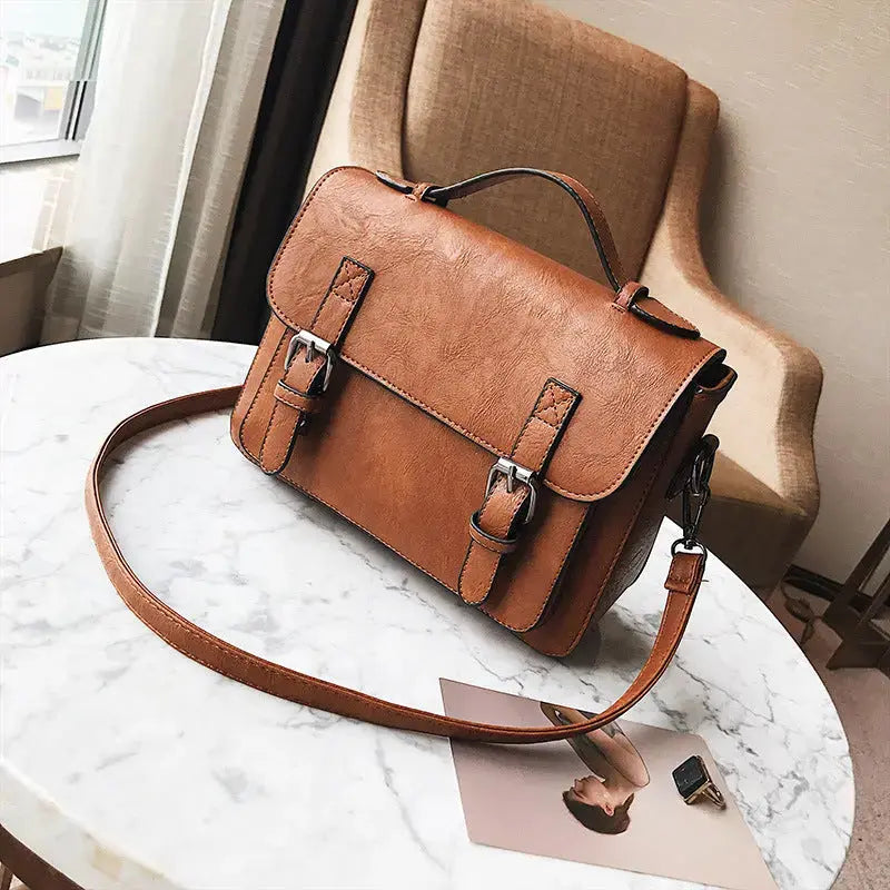 Hypes Inventory tassel crossbody bag for women with square shoulder design, featuring a stylish and functional handbag.