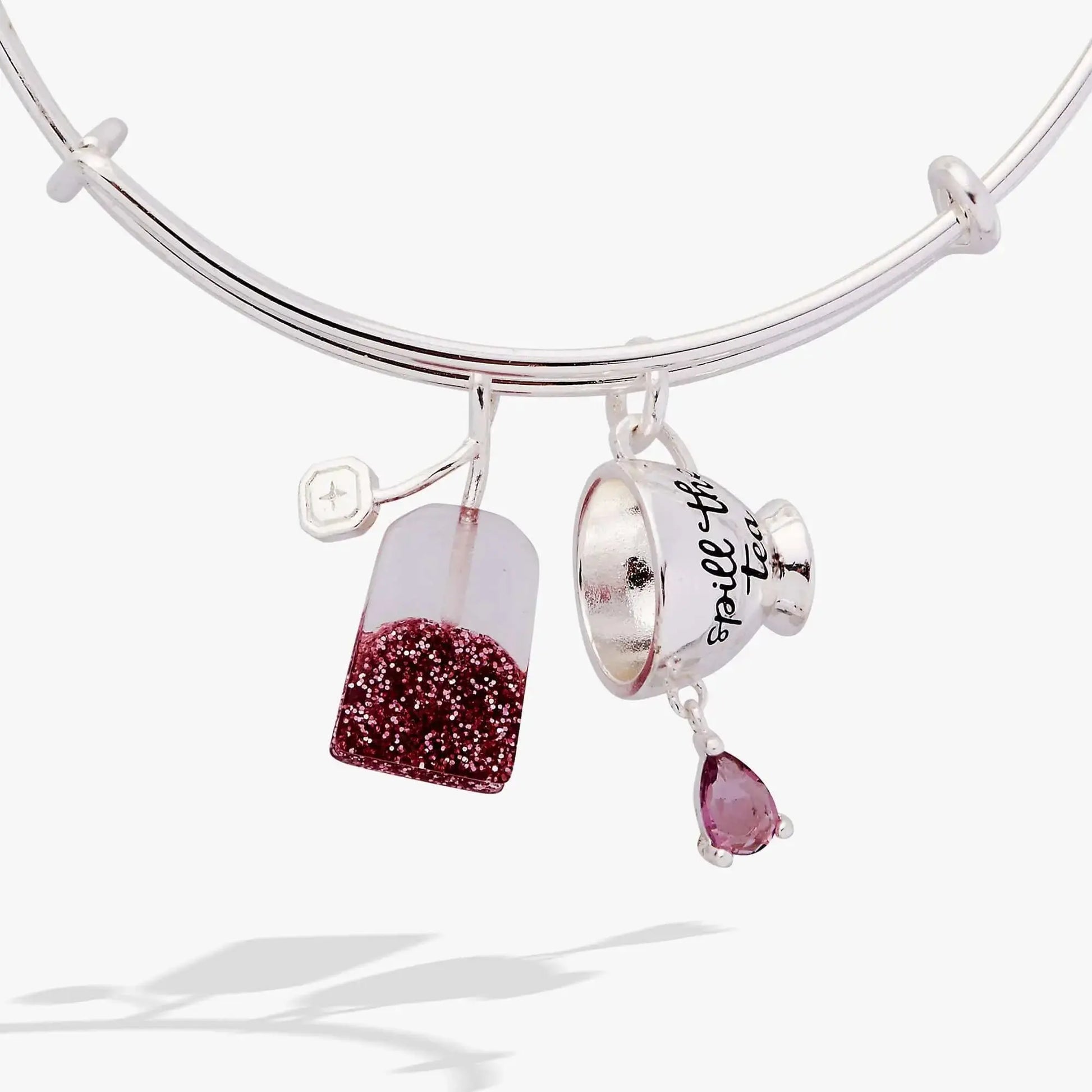 ALEX AND ANI spill-the-tea duo charm bracelet with tea bag and teacup charms on a silver bangle.