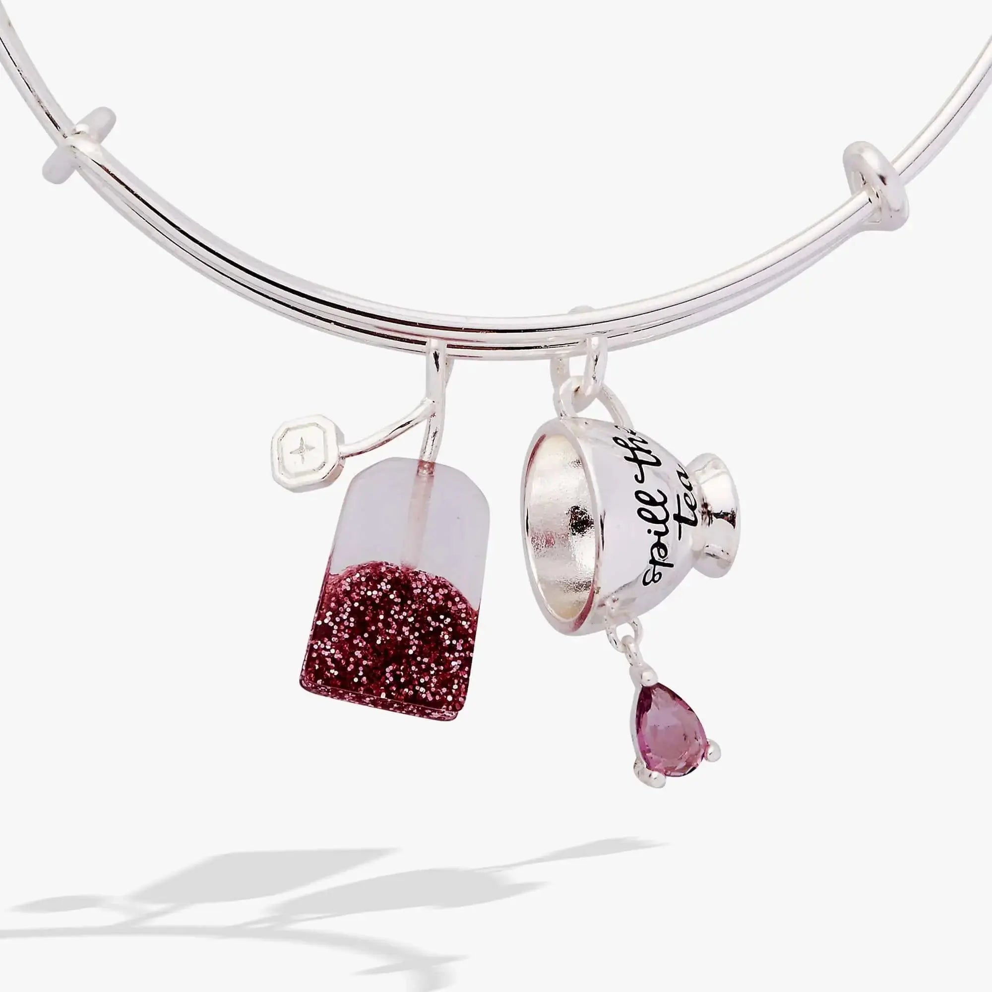 ALEX AND ANI spill-the-tea duo charm bracelet with tea bag and teacup charms on a silver bangle.