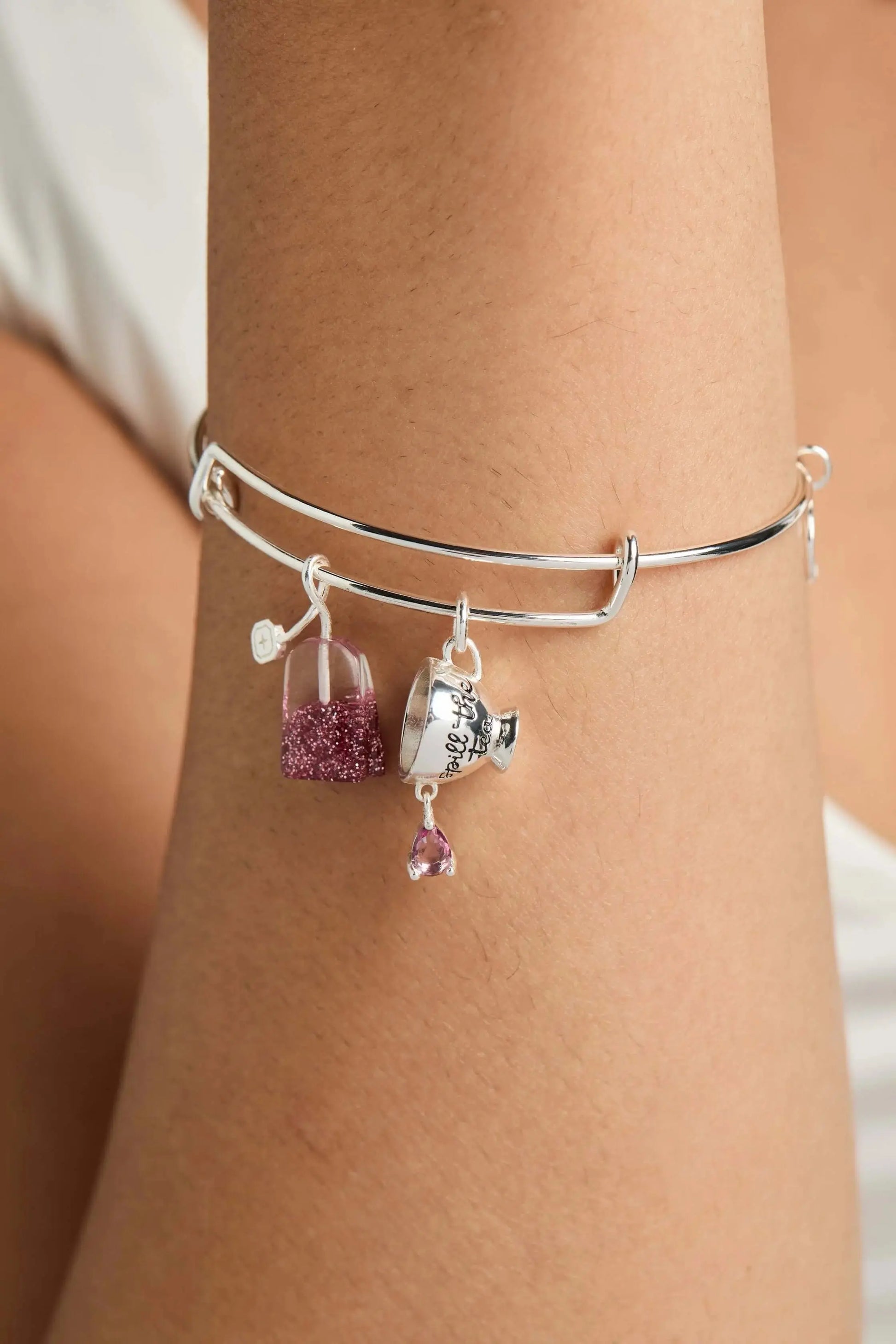 ALEX AND ANI tea bag charm bangle bracelet with fall-themed spill the tea design and colorful accents.