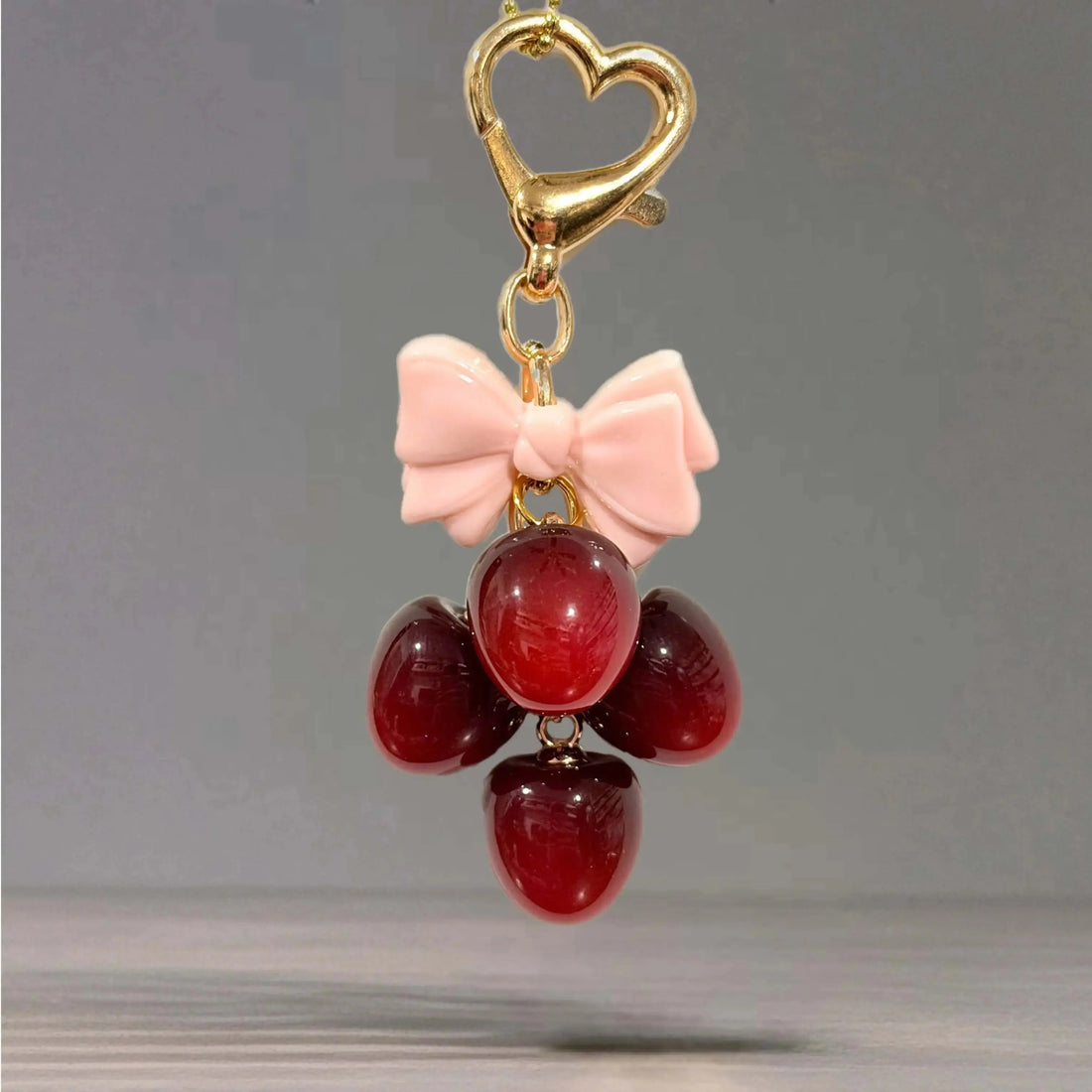 Deluxe Cherry Charm - Tumbler Handle Charm featuring a heart clasp and bow with decorative cherry accents.