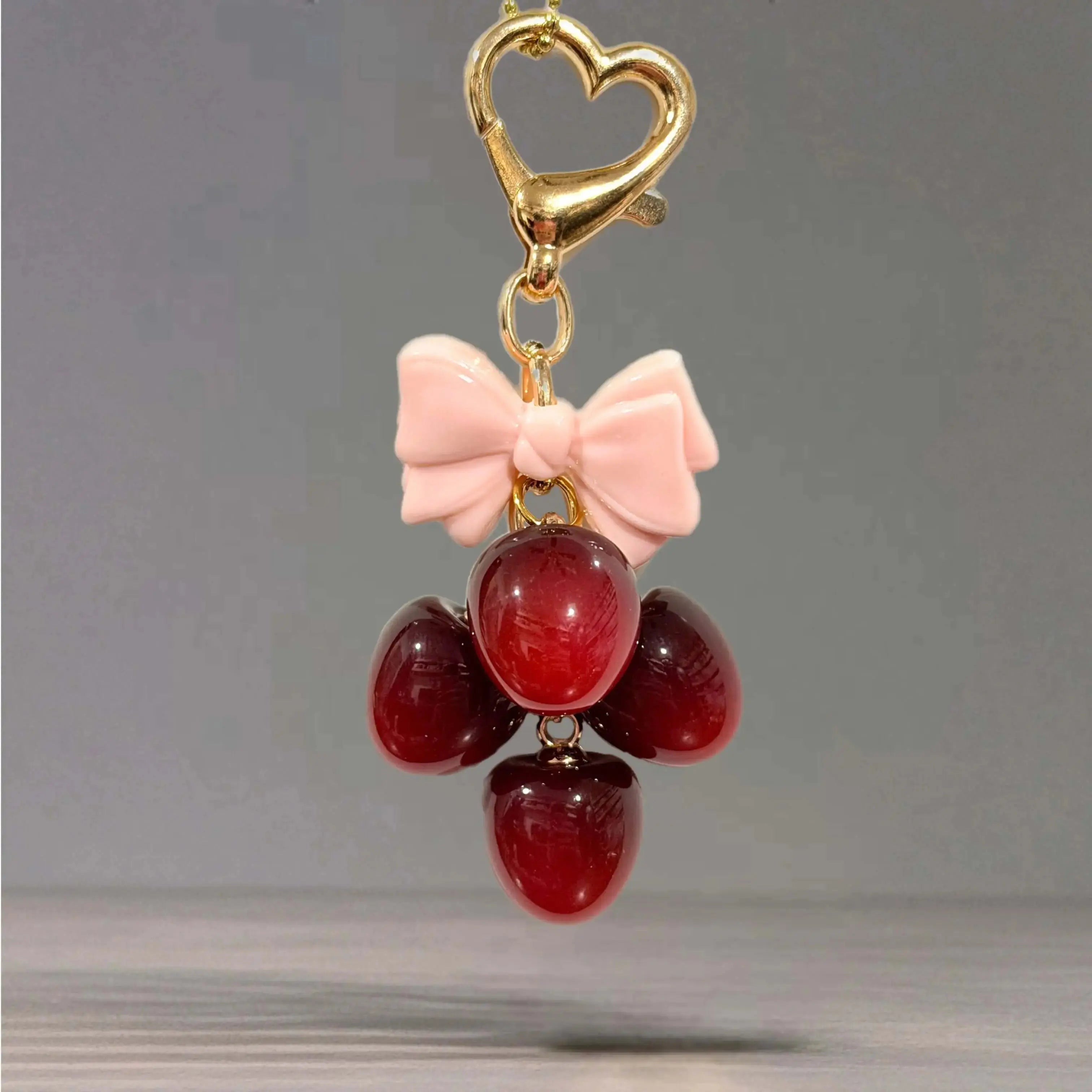 Deluxe Cherry Charm - Tumbler Handle Charm featuring a heart clasp and bow with decorative cherry accents.
