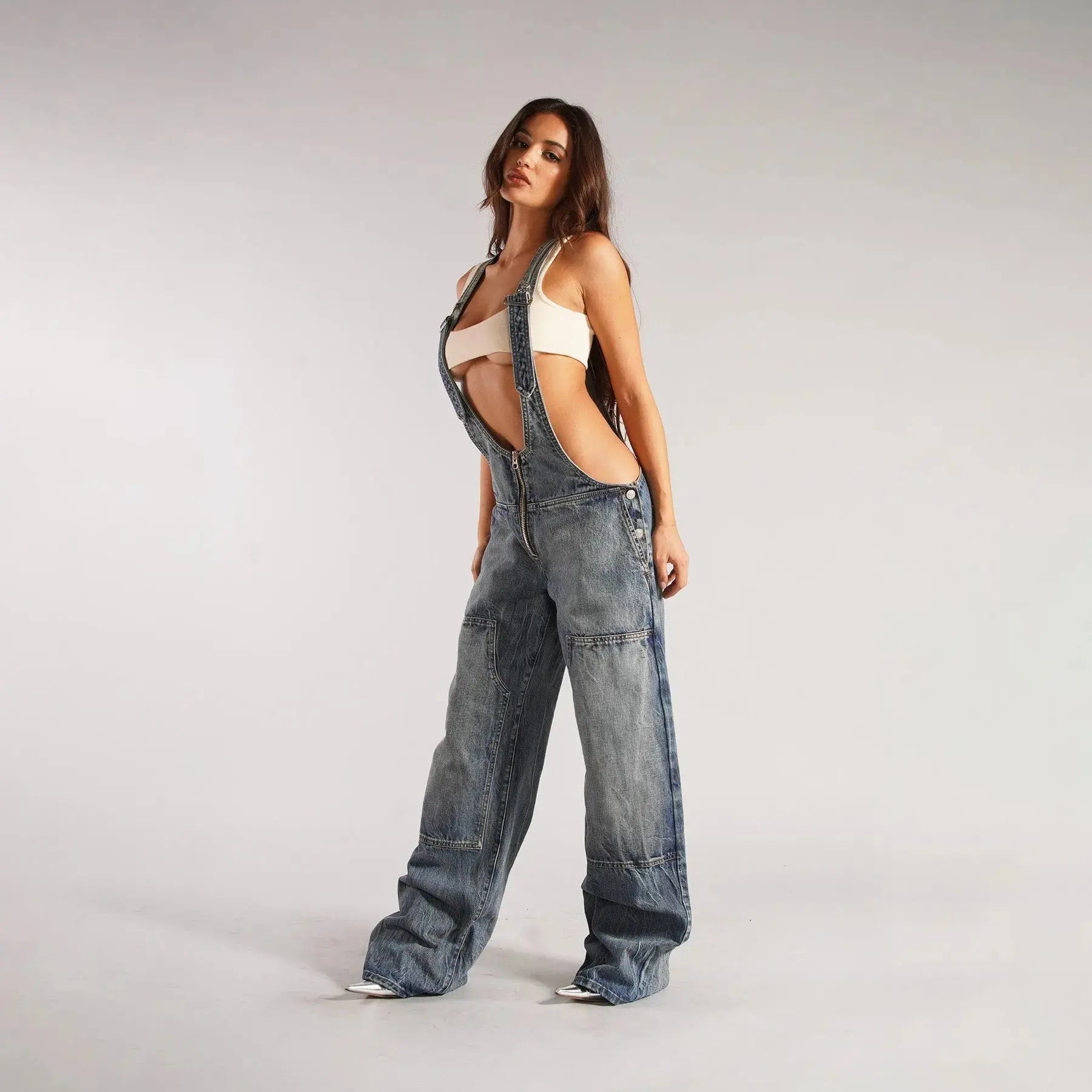 Black Y2K denim overalls for women with zip front, loose fit, and front pockets by Flairé™.