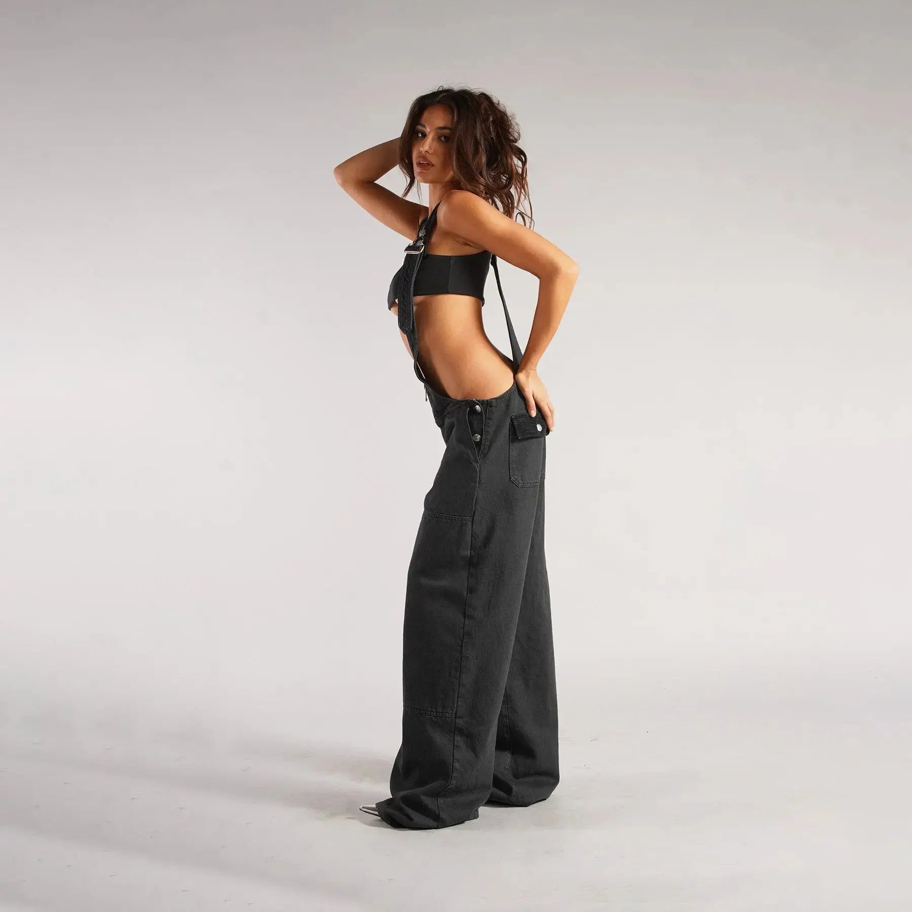 Black Y2K denim overalls for women by Flairé™, loose fit zip front jumpsuit with front pockets and casual style.