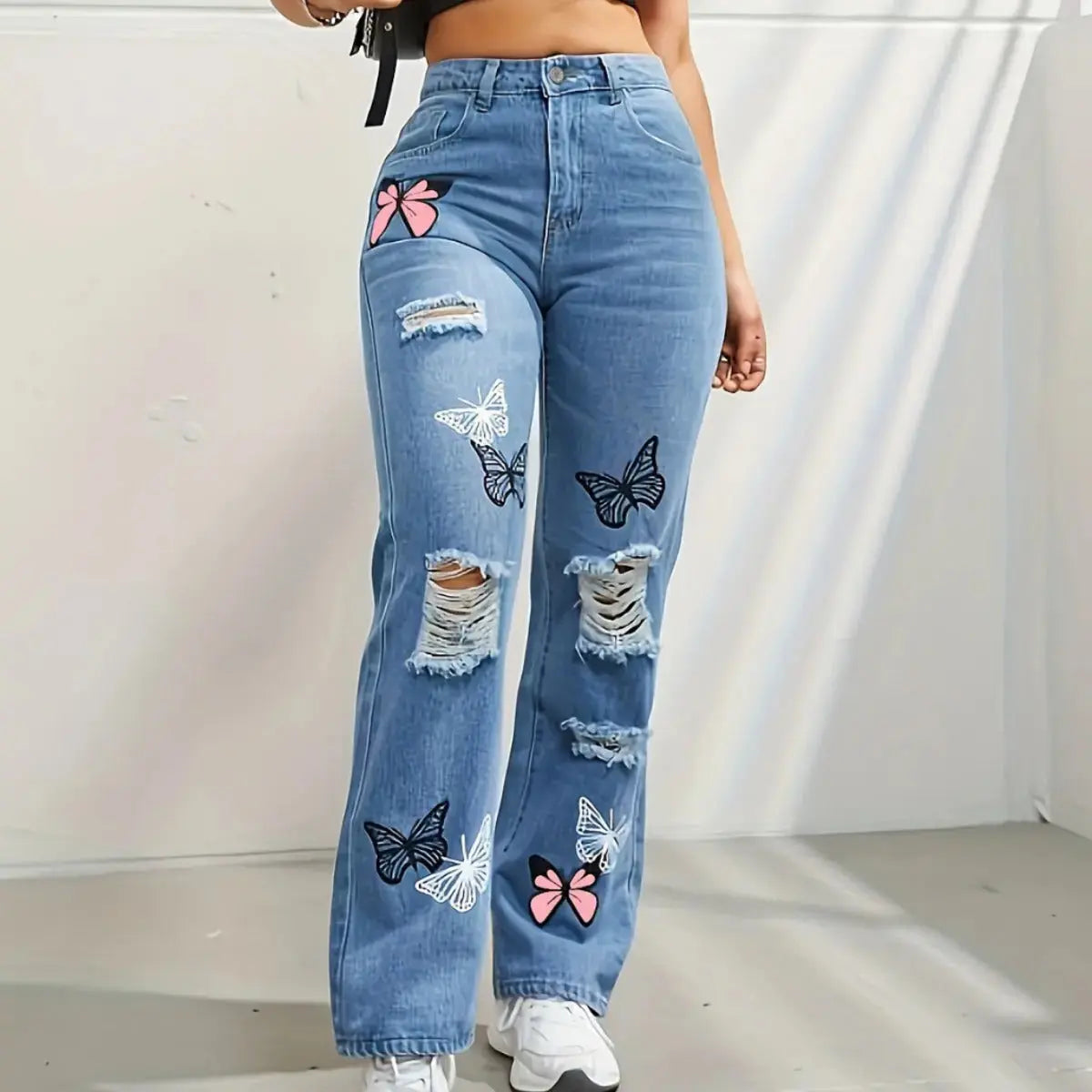 Flairé™ Butterfly Print high waist distressed straight leg denim jeans with ripped details and butterfly pattern design.