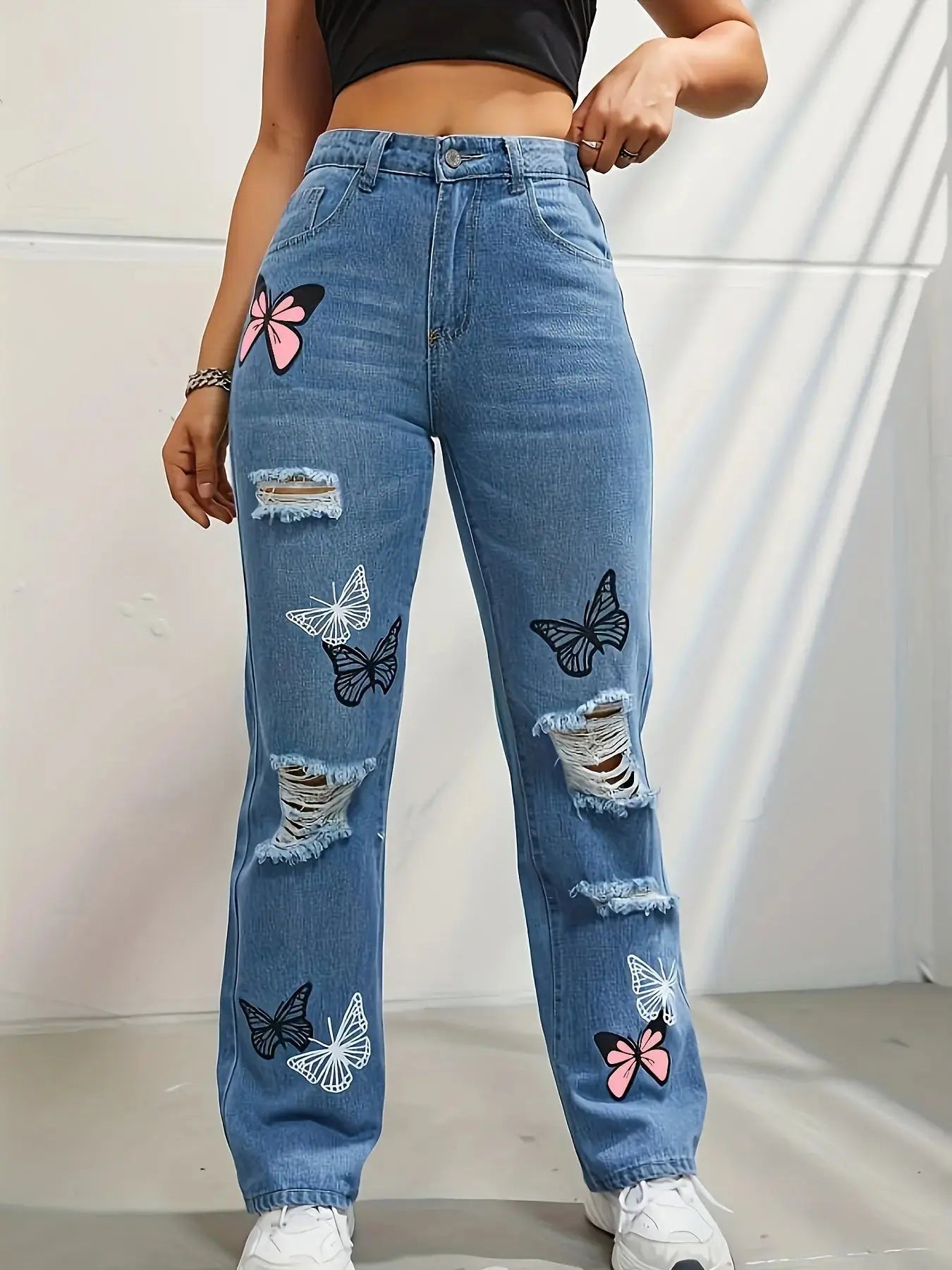 Flairé™ Butterfly Print high waist distressed straight leg jeans with ripped details and butterfly embroidery on denim.