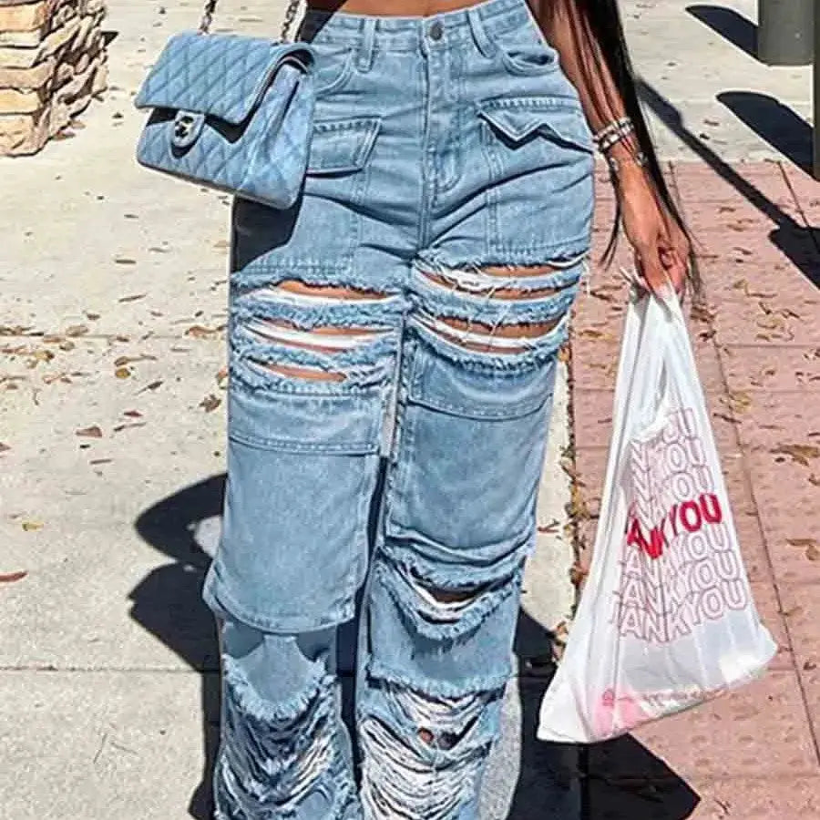 Blue Flairé™ high waist ripped distressed jeans with raw hem, showcasing a trendy denim style for women.