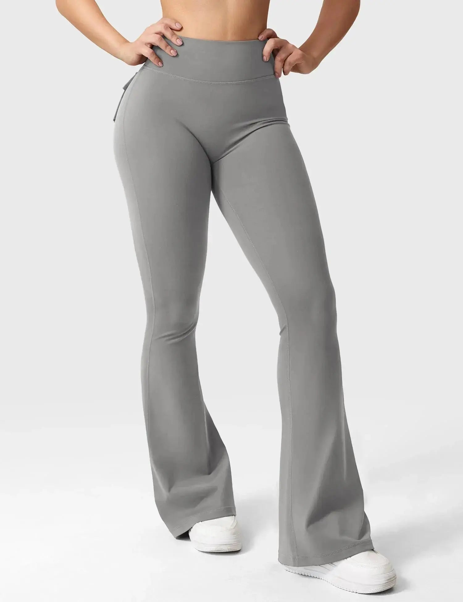 Light grey Flairé™ 30-inch high-waisted flare leggings with pockets, designed for yoga and athleisure wear, shown on a model.