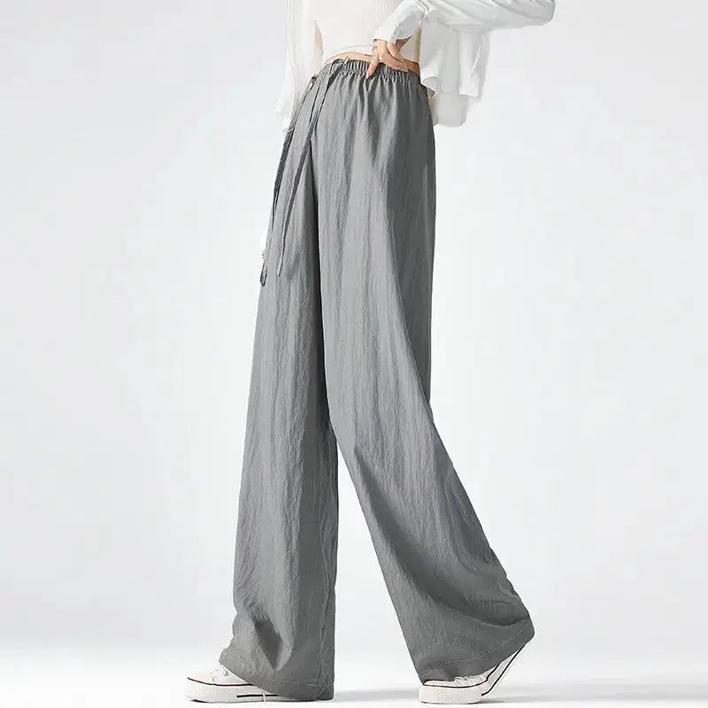Dark gray Flairé™ high waist wide leg pants for women, relaxed fit minimalist trousers with a stylish, flowing silhouette.