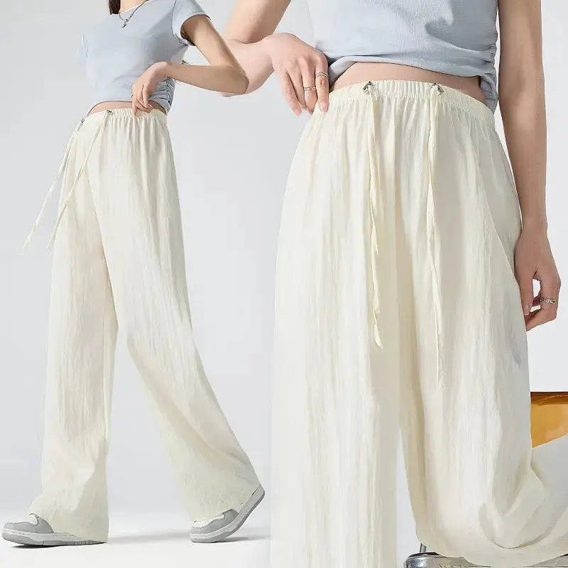 Dark gray Flairé™ high waist wide leg pants for women, relaxed fit minimalist trousers with a stylish, flowing silhouette.
