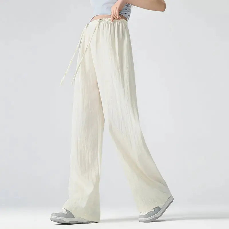Dark gray Flairé™ high waist wide leg pants for women, relaxed fit minimalist trousers with a stylish, flowing silhouette.