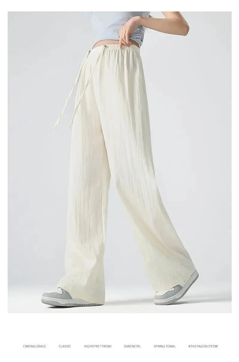 Dark gray Flairé™ high waist wide leg pants for women, relaxed fit, minimalist design, comfortable flowy trousers.