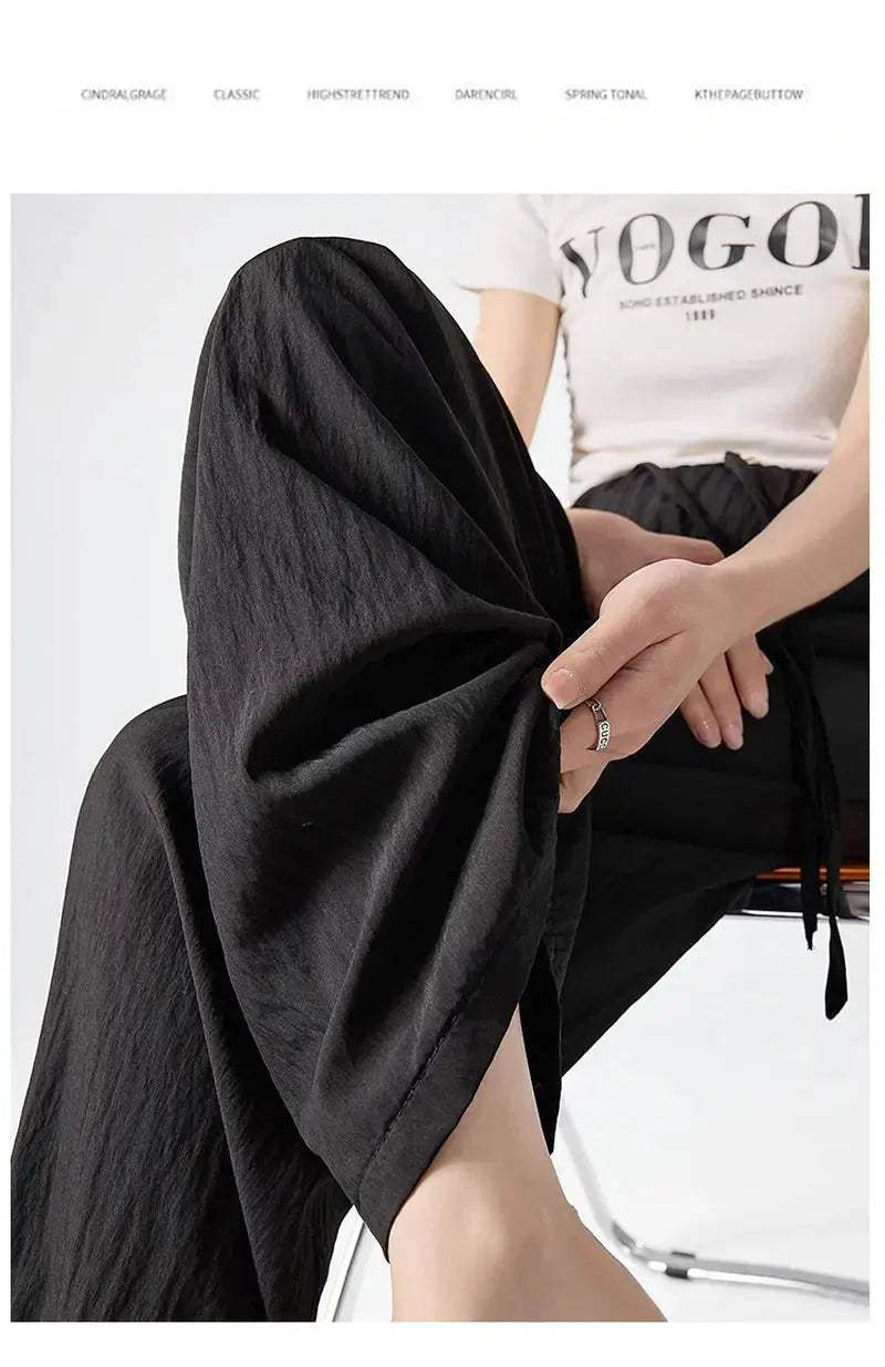 Dark gray Flairé™ high waist wide leg pants for women, relaxed fit minimalist trousers with a stylish wide leg design.