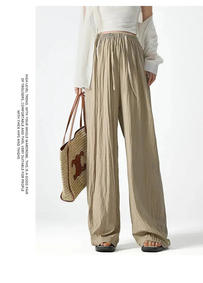 Dark gray Flairé™ high waist wide leg pants for women, relaxed fit minimalist trousers with a stylish, comfortable design.