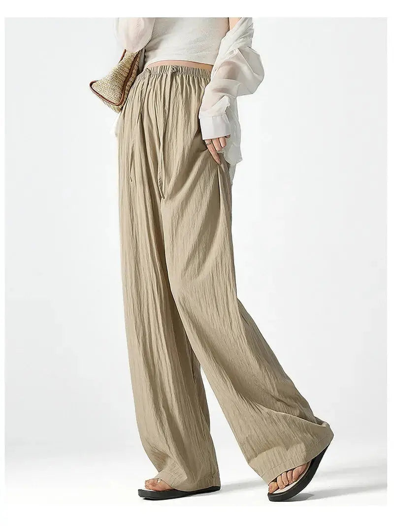 Dark gray Flairé™ high waist wide leg pants for women, relaxed fit minimalist trousers with a sleek, modern style.