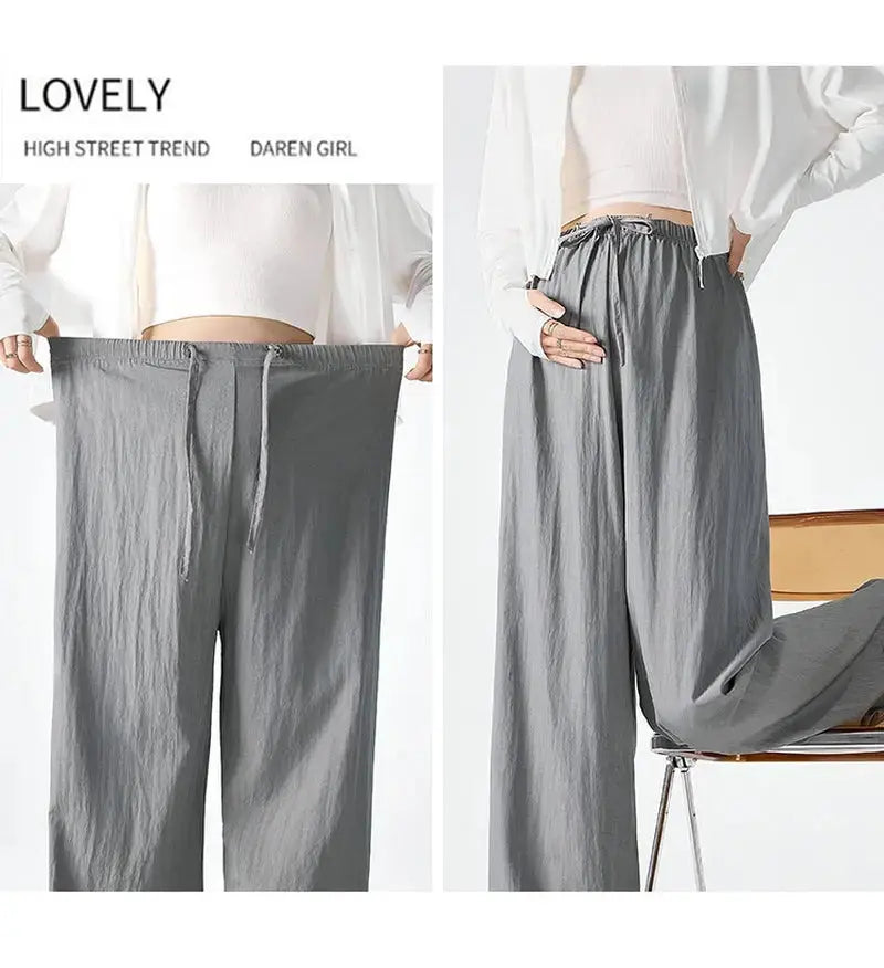 Dark gray Flairé™ high waist wide leg pants for women, relaxed fit minimalist trousers with a comfortable, flowing design.