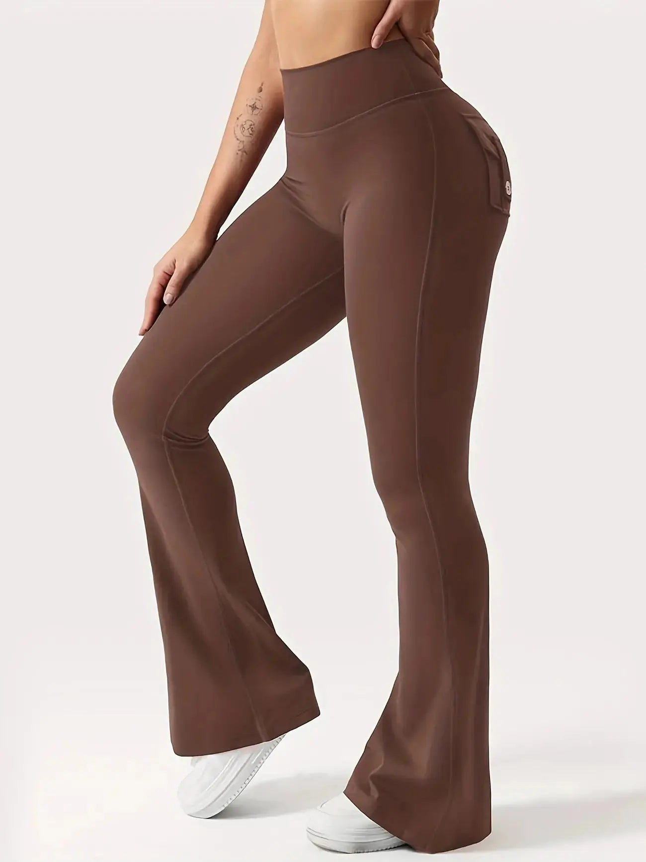 Flairé™ high waisted flare leggings with pockets, tummy control yoga pants in black, showing the fitted waistband and flared leg design.