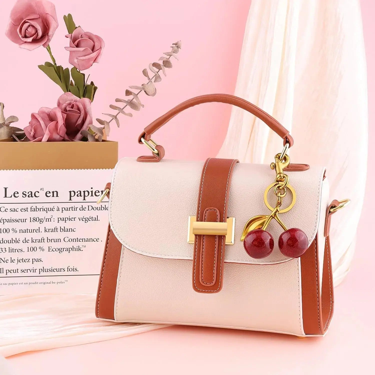 Red cherry purse charm keychain by Hypes Inventory, featuring a cute cherry and strawberry design for handbags and accessories.