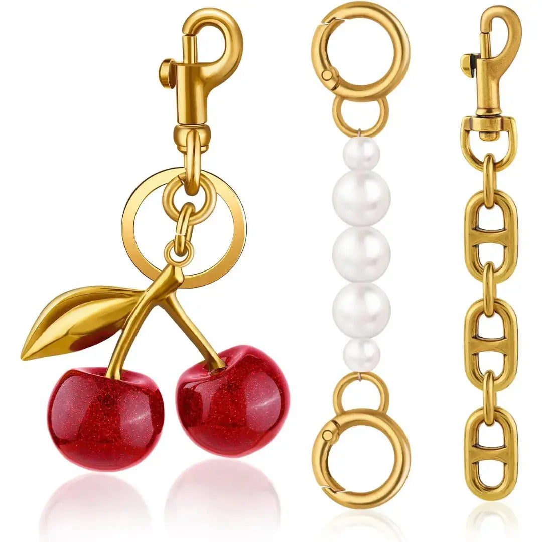 Red cherry purse charm keychain by Hypes Inventory, featuring a cute cherry and strawberry design for handbags and gift-giving.