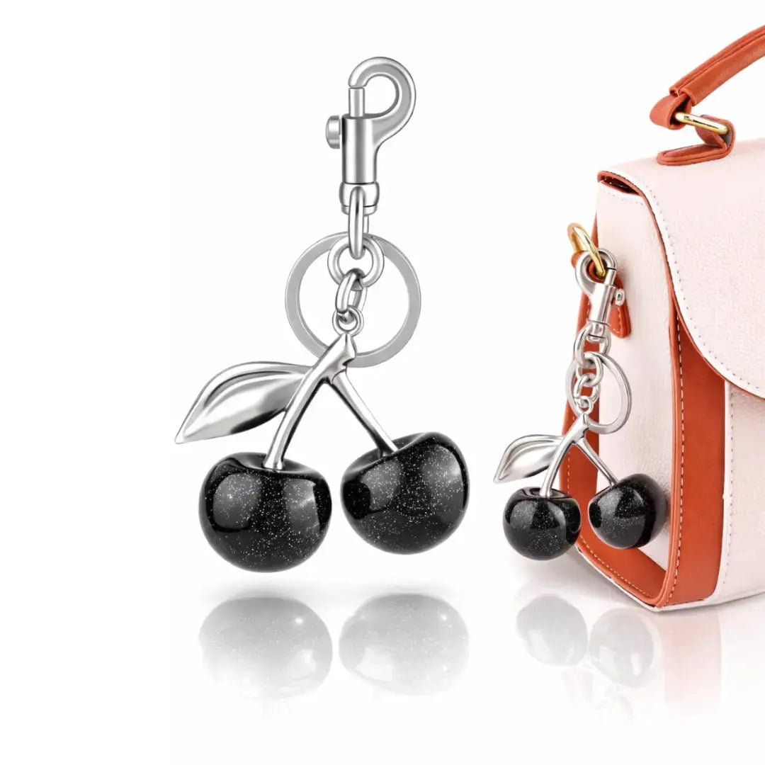 Red cherry purse charm keychain by Hypes Inventory, featuring a cute cherry and strawberry design for handbags and accessories.