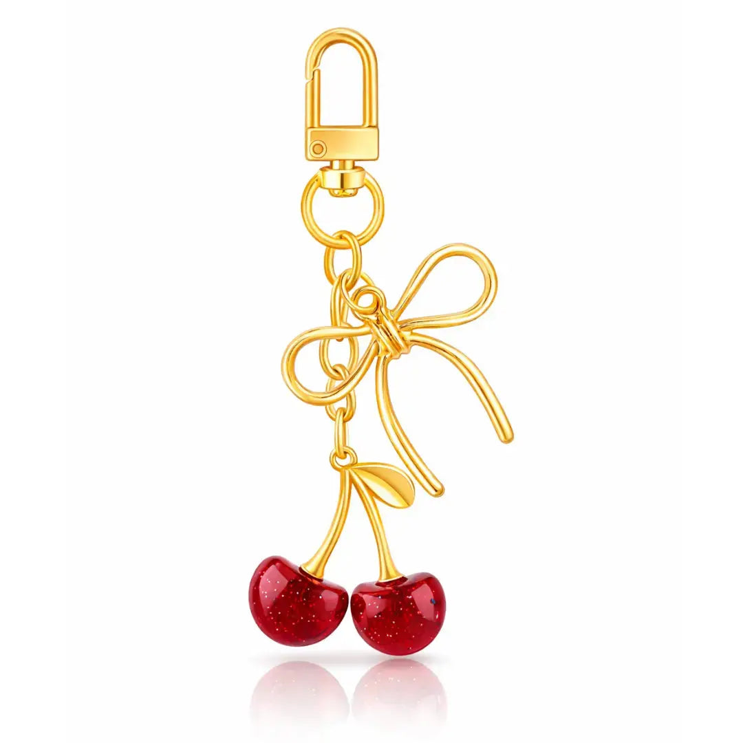 Red cherry purse charm keychain by Hypes Inventory, featuring a cute cherry and strawberry design for handbags and gifts for women.