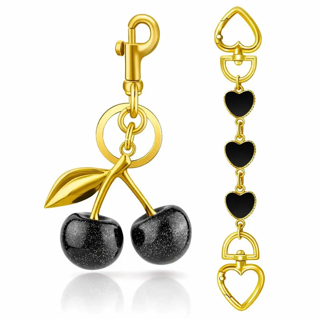 Red cherry bag charm and strawberry keychain by Hypes Inventory, perfect for handbags and adding a cute, stylish touch.