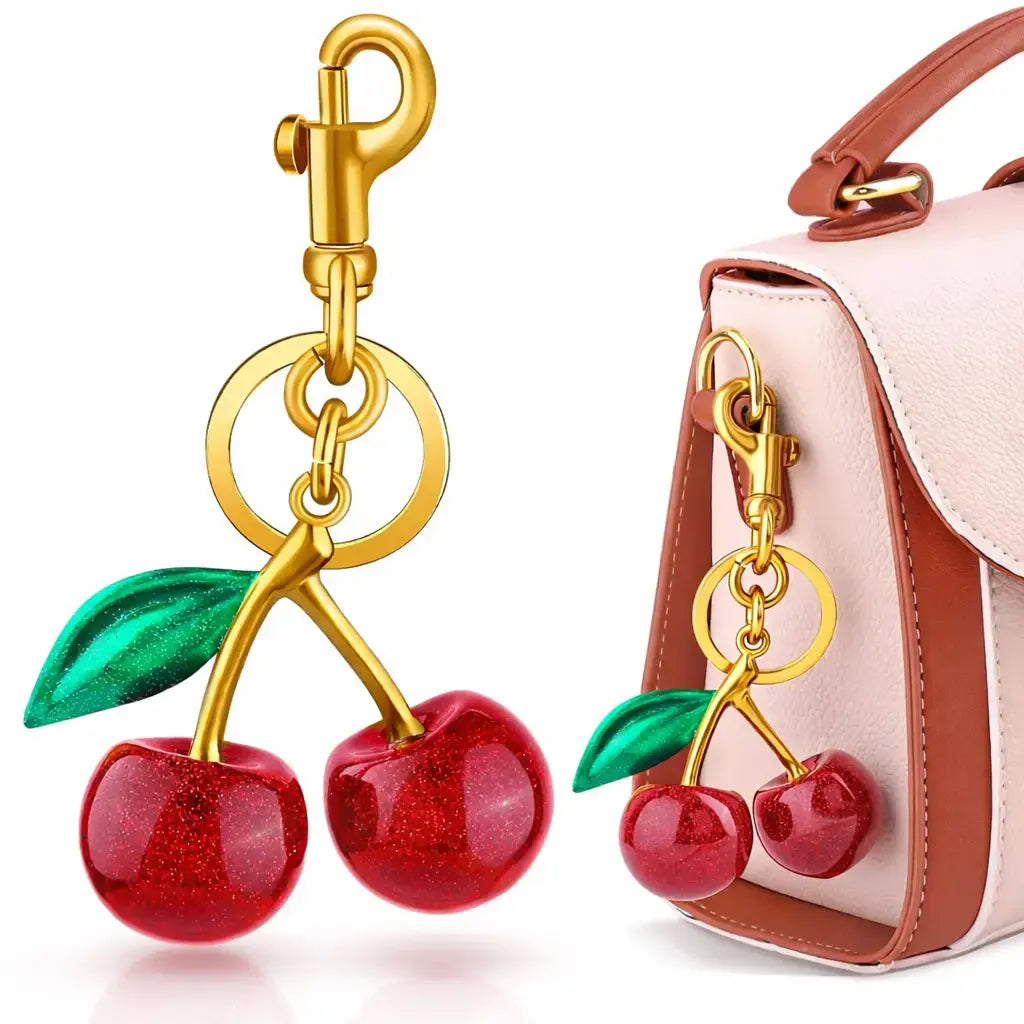 Red cherry purse charm keychain by Hypes Inventory, featuring a cute cherry and strawberry design for handbags or bags.