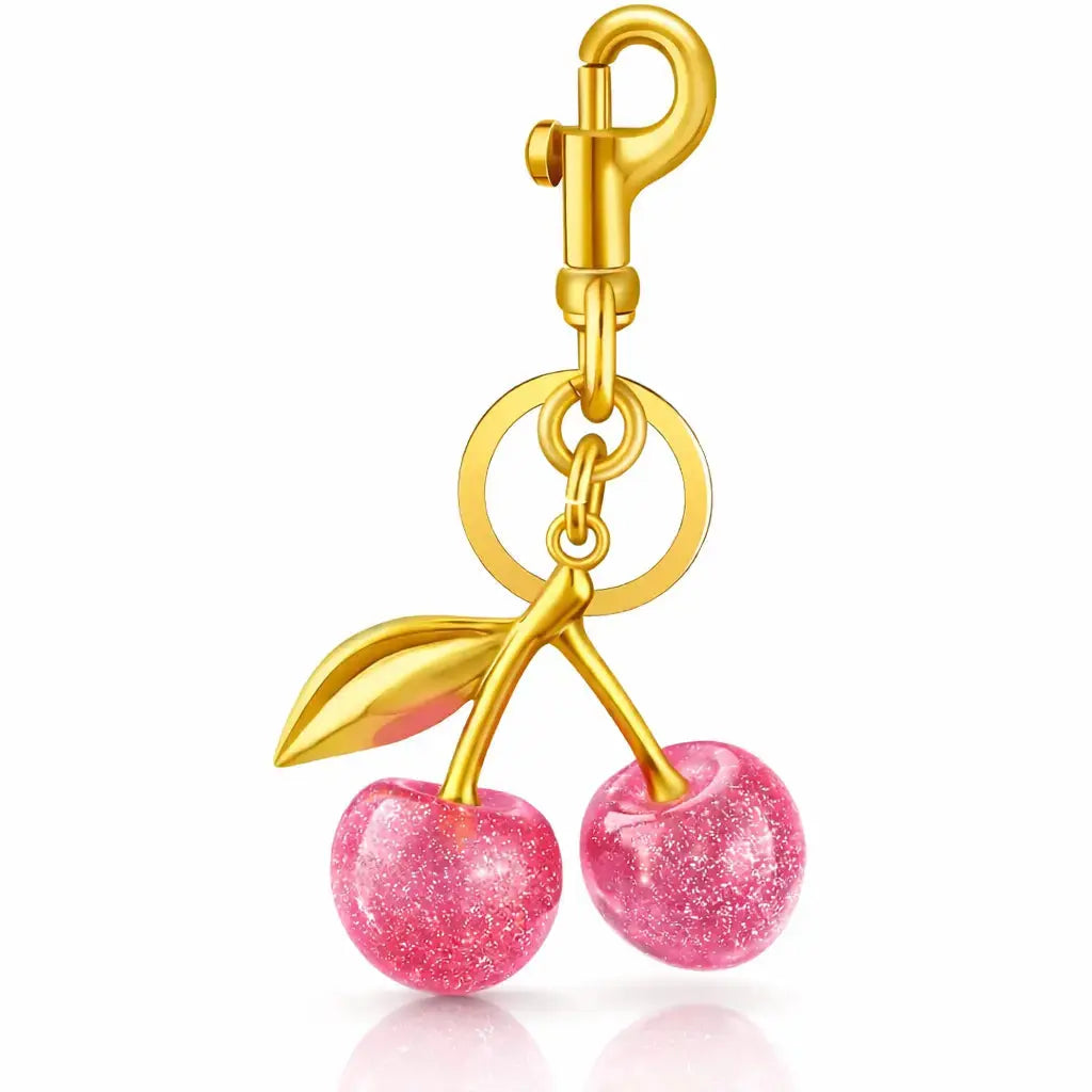 Red cherry bag charm and strawberry keychain by Hypes Inventory, perfect for handbags and as a cute gift for women.
