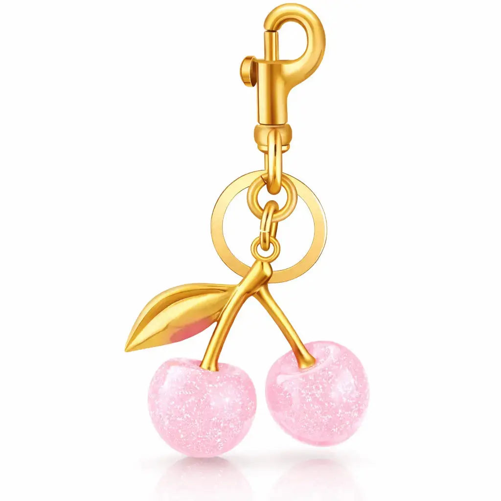 Red cherry purse charm and strawberry keychain by Hypes Inventory, designed for handbags, cute and colorful accessories for women.