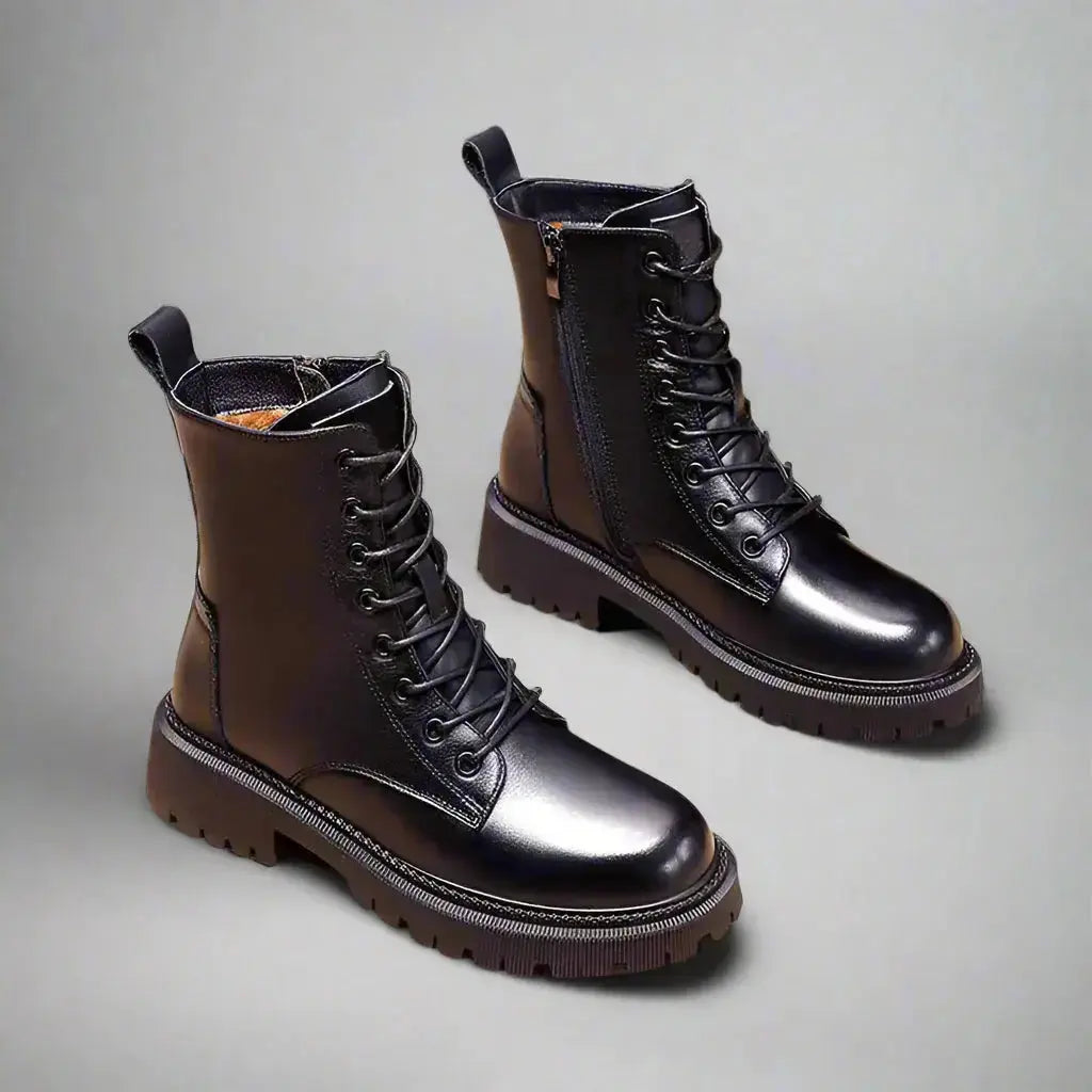 Black leather winter boots for women with British Martin style, featuring sleek design and sturdy soles by Hypes Inventory.