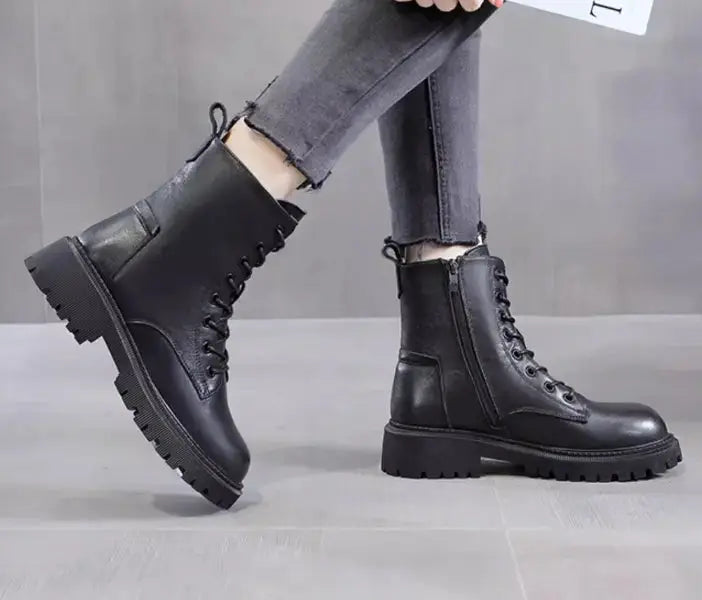 Delphine black leather winter boots for women by Hypes Inventory, British Martin style, featuring ankle-high design and sturdy soles.