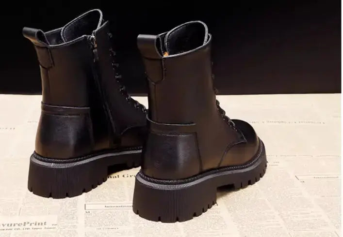 Hypes Inventory Delphine black leather winter boots for women, British Martin style with sturdy soles and sleek design.