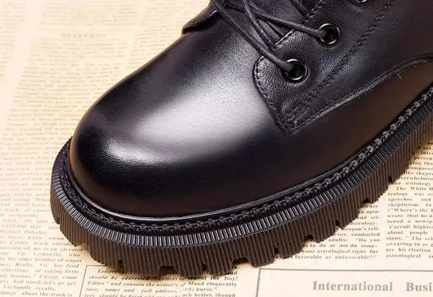 Delphine black leather winter boots for women by Hypes Inventory, featuring a British Martin style with sturdy soles and sleek design.