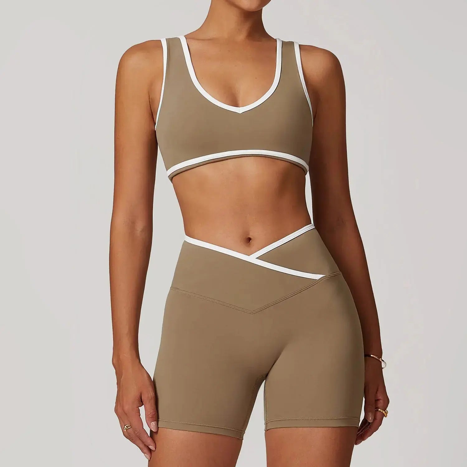 Women wearing Flaire™ Cross High Waist Yoga Set by Hypes Inventory, showing the fitted black workout leggings and sports bra.