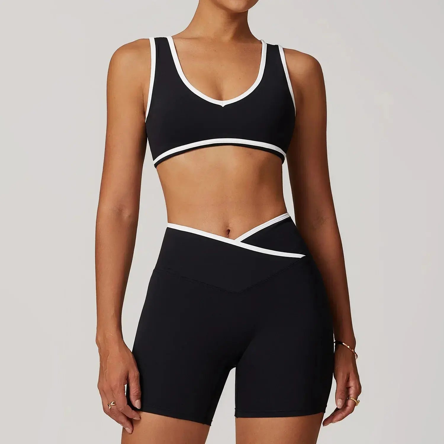 Women wearing Hypes Inventory Flaire™ Cross High Waist Yoga Set for fitness, showing the stylish black workout outfit.