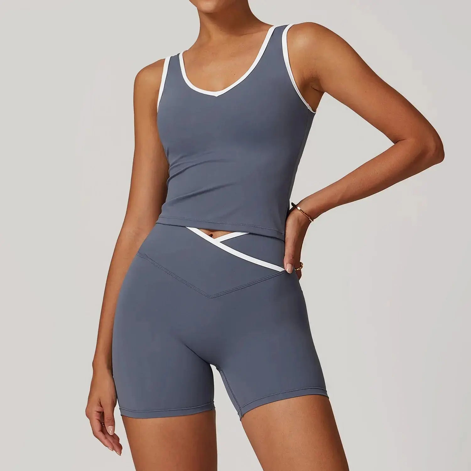 Women’s high-waist yoga set with Flaire™ Cross design, including matching sports bra and leggings for fitness workouts.